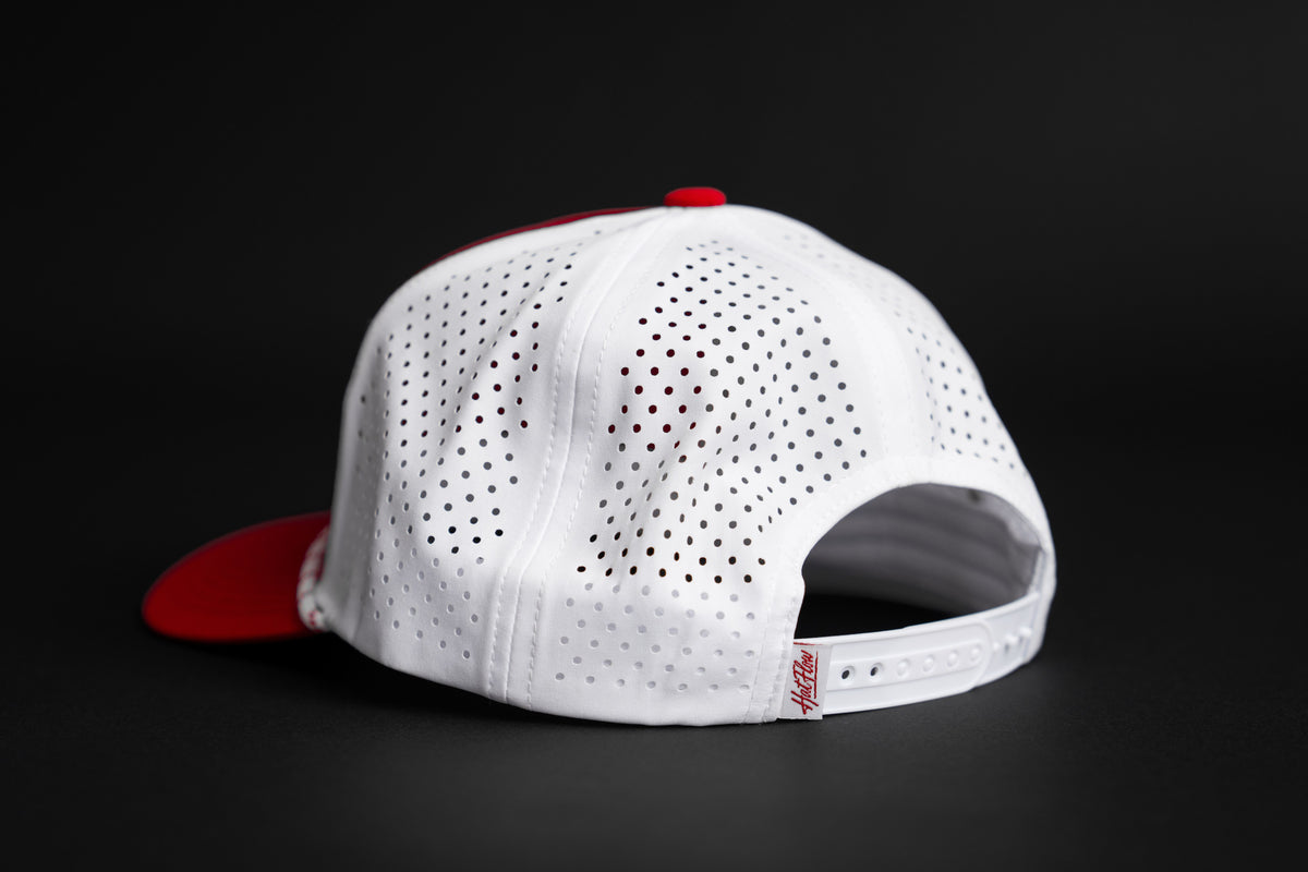 White perforated back panels and snapback on garnet and white Carolina script hat