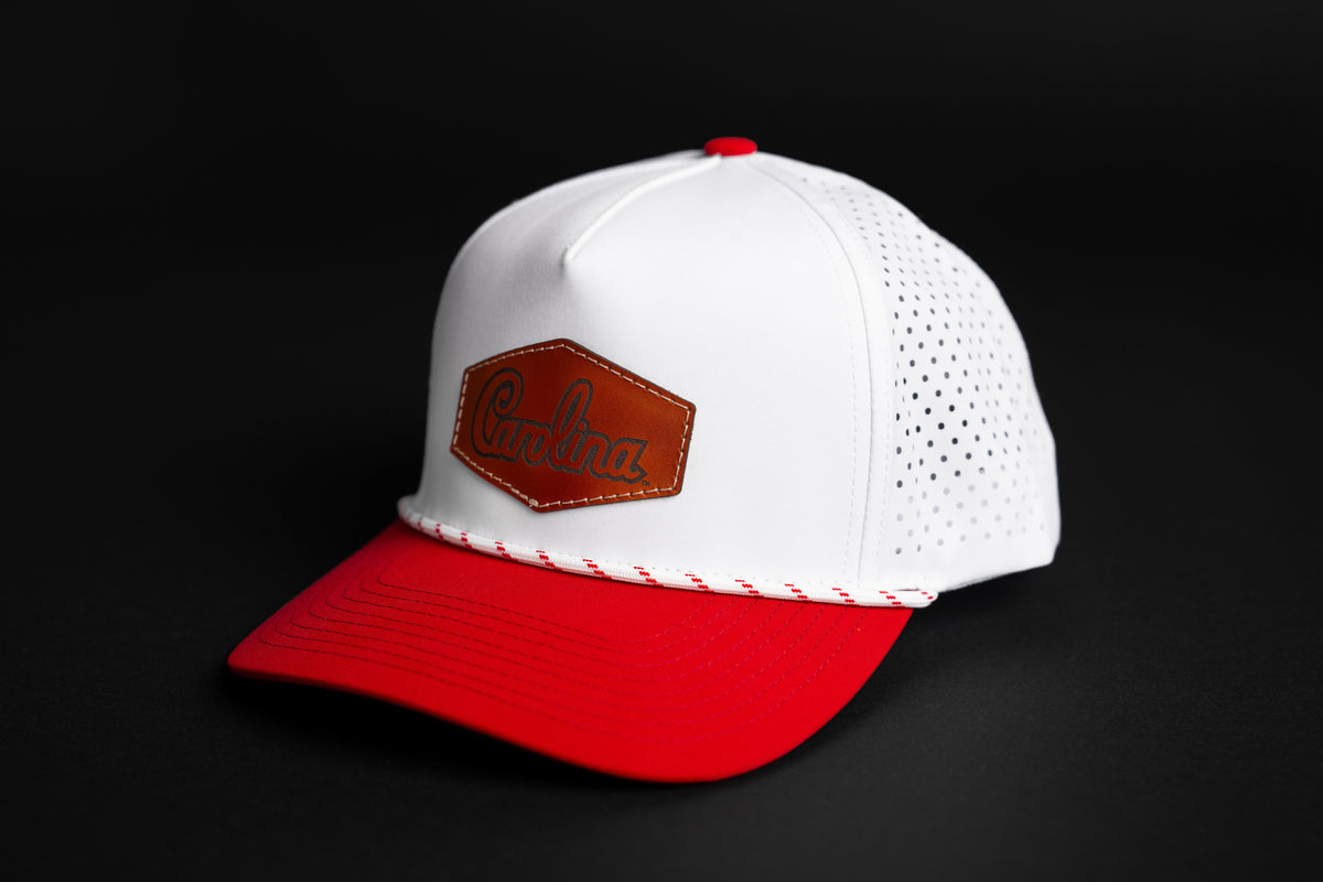 Carolina script leather patch performance rope hat with white crown and garnet bill, front view