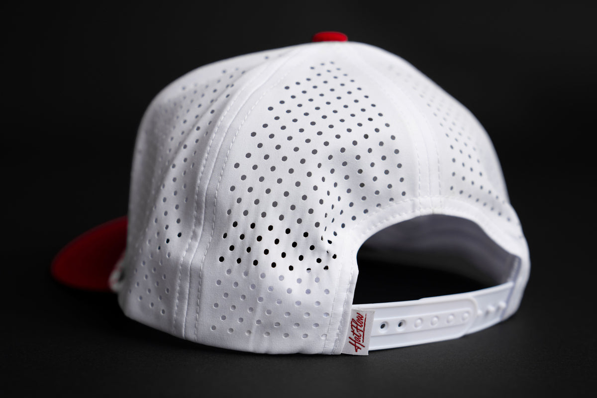 Interior HatFlow branding and perforated panels on hat with garnet bill